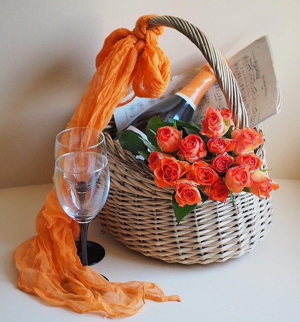 Photo of a Gift Basket with wine, a wine glass, and roses